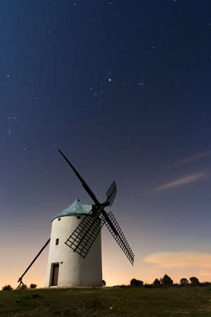 A typical windmill surrounded of stars in Castilla la Mancha, Spainの写真素材