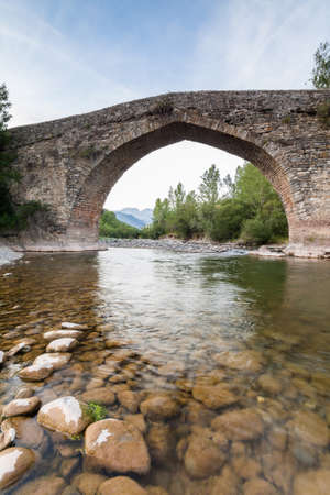 Ancient roman bridge in the north of Aragon, Spain  Valle de Hecho の写真素材