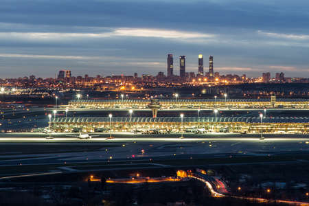 Madrid-Barajas Airport with the Four Towers Business Area at the backgroundの写真素材