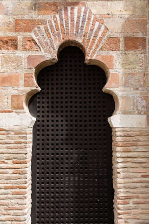 Arabic style window in a brick made wallの写真素材