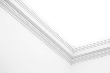 Ornamental moulding in the corner of a white roomの写真素材