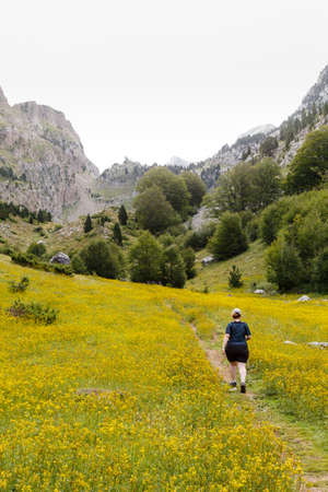 A woman is walking in Zuriza's Valley, Spanish Pirineosの写真素材