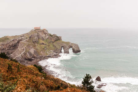 Old chapel on the cliff, by the sea. San Juan de Gaztelugatxe, Basque Countryの写真素材
