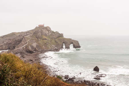 Old chapel on the cliff, by the sea. San Juan de Gaztelugatxe, Basque Countryの写真素材