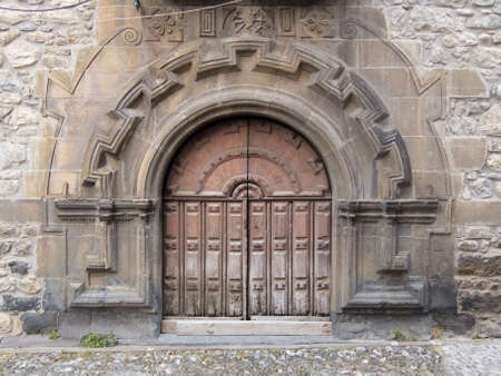 Old church door in Potes, Cantabria (Spain)の写真素材