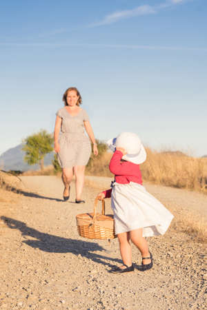 Portrait of happy mother and daughter in the countryの写真素材
