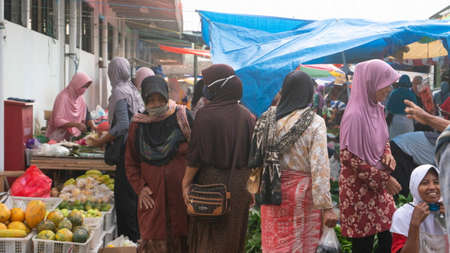 Trade in a traditional market. There are various kinds of local products with the best quality including vegetables and fruits and foodstuffs - Ponorogo, East Java, Indonesia- 10/05/2020のeditorial素材