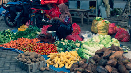 Trade in a traditional market. There are various kinds of local products with the best quality including vegetables and fruits and foodstuffs - Ponorogo, East Java, Indonesia- 10/05/2020のeditorial素材