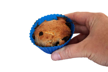 A home baked apple raisin muffin on a white backgroundの写真素材