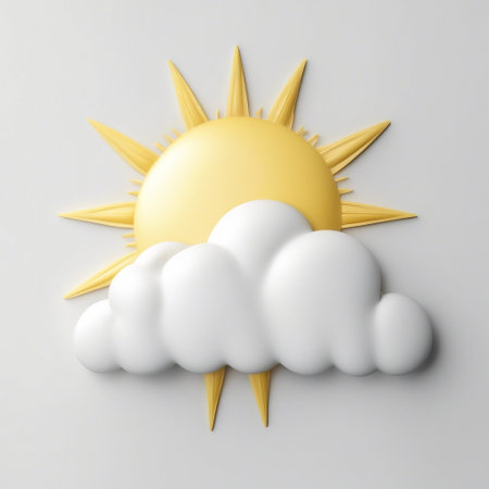 Yellow sun partially hidden by a white cloud.の素材