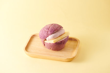 Mochi cake on wooden plate on yellow background, Japanese dessert