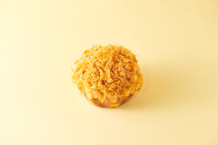 Crispy fried dough stick on a yellow background. Selective focus.の写真素材