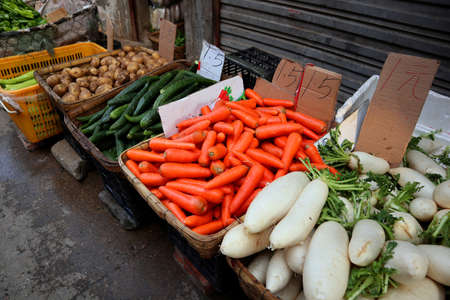 There are all kinds of vegetables and fruits for sale in the marketの写真素材