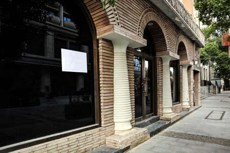 This is a storefront for rent in a business districtの写真素材