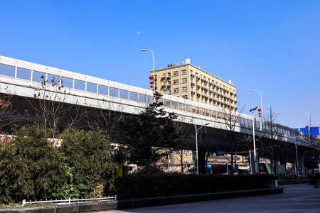 There is an office building next to the city overpassの写真素材