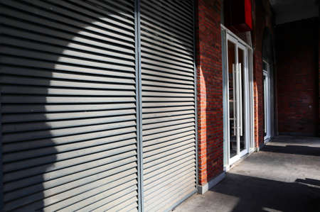 small shop with a closed door
