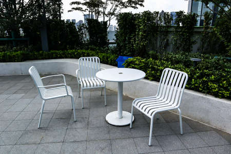 Tables and chairs in the outdoor dining roomの写真素材