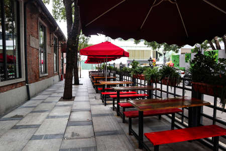 Tables and chairs in the outdoor dining roomの写真素材
