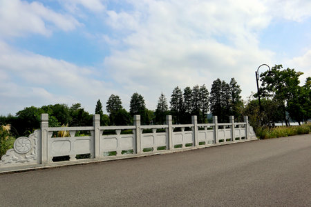 beautiful view of a park in China with a strong stone bridgeの写真素材