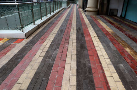 The floors of the business district are covered in red, white and grey tilesの写真素材