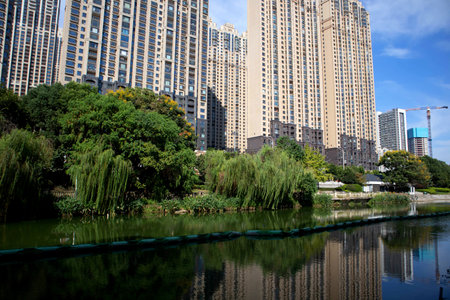 Under the blue sky, these modern skyscrapers are apartments and offices in a Chinese cityの写真素材