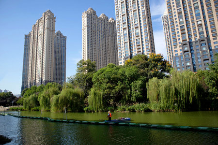 Under the blue sky, these modern skyscrapers are apartments and offices in a Chinese cityの写真素材