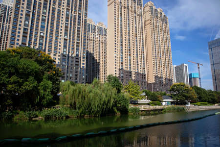 Under the blue sky, these modern skyscrapers are apartments and offices in a Chinese cityの写真素材