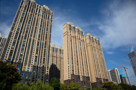 Under the blue sky, these modern skyscrapers are apartments and offices in a Chinese cityの写真素材