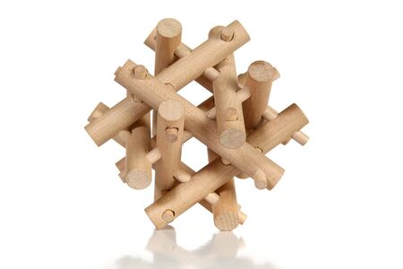 Wooden puzzle over white background.の写真素材