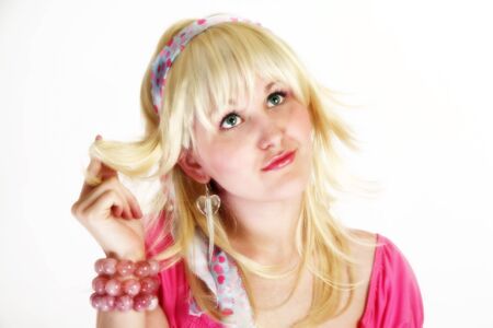 High key potrait of beautiful 18 year old girl in making thinking or confused expression.の写真素材