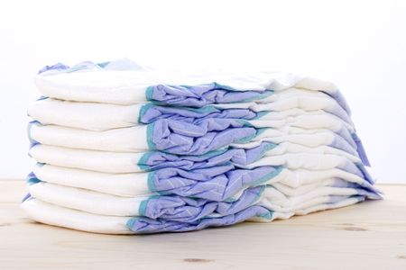 Stack of diapers on a tableの写真素材