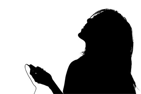 Silhouette over white with clipping path. Of young woman listening to music.の写真素材