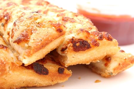 Take out box of cheese and garlic bread sticks with a container of marinara sauce.
