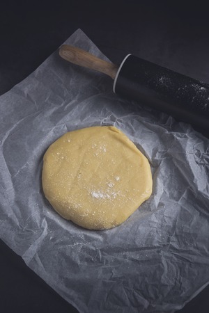 Delicious homemade sweet dough shaped with rolling pin. Verticalの写真素材