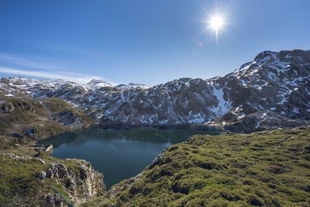 Calabazosa lake at the end of winter with snowy areas in the mountains. Saliencia lakes in the Somiedo Nature Park, Asturias, Spain.の写真素材