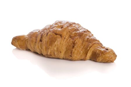Homemade croissant isolated on white background with reflection.の写真素材