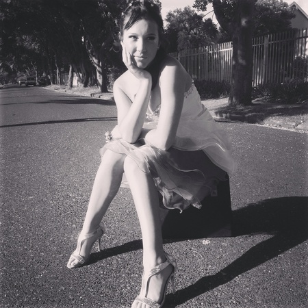 Girl sitting on suitcaseの素材