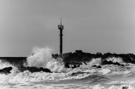 Impression of big waves from the North Sea breaking on the coast near Hoek van Holland, Netherlandsの写真素材