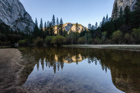 Early moring reflections of the Mountains in Mirror Lake, Yosemite National Park.の写真素材