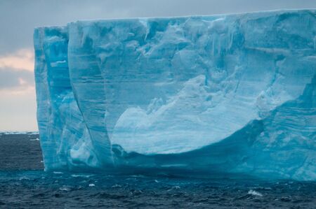 A large tabular iceberg floating in the southern atlantic ocean, near Antarctica.の写真素材