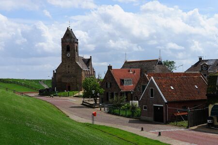 A small church near the Zeedijk in the small village of Wierum, Friesland, the Netherlands.の写真素材