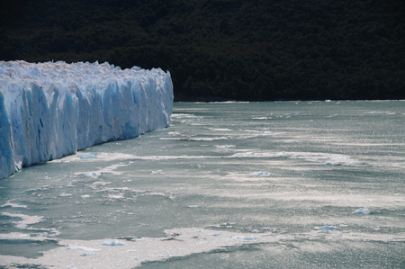 A giant piece of Ice breaks off the Perito Moreno Glacier in Patagonia, Argentinaの写真素材