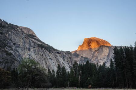 Half Dome illuminated by the last rays of the setting sun