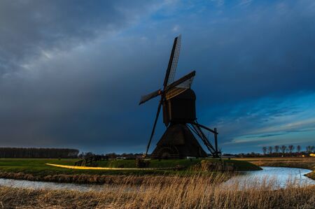 Windmills at the Nieuw Hollandse Waterlinie near Werkendamの写真素材