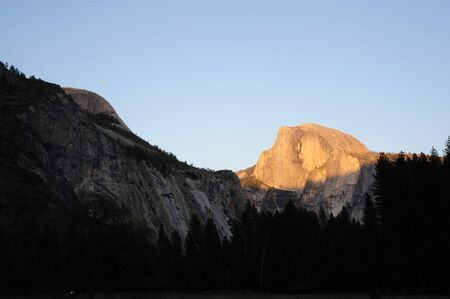 Half Dome illuminated by the last rays of the setting sunの写真素材