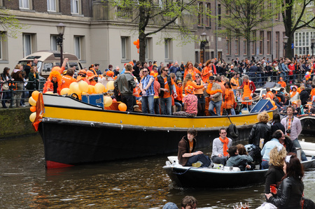 AMSTERDAM, NETHERLANDS - APRIL 30. Young People Celebrating Queensday in Amsterdam. Queensday is a popular annual festival celebrating the Queens Birthday.のeditorial素材