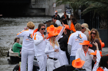 AMSTERDAM, NETHERLANDS - APRIL 30. Young People Celebrating Queensday in Amsterdam. Queensday is a popular annual festival celebrating the Queens Birthday.のeditorial素材
