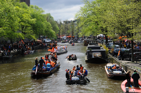 AMSTERDAM, NETHERLANDS - APRIL 30. Young People Celebrating Queensday in Amsterdam. Queensday is a popular annual festival celebrating the Queens Birthday.のeditorial素材