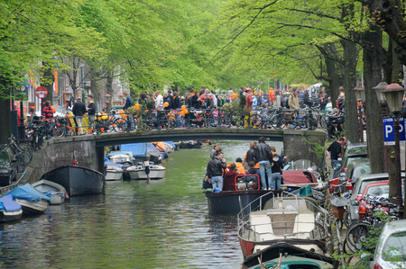 AMSTERDAM, NETHERLANDS - APRIL 30. Young People Celebrating Queensday in Amsterdam. Queensday is a popular annual festival celebrating the Queens Birthday.のeditorial素材