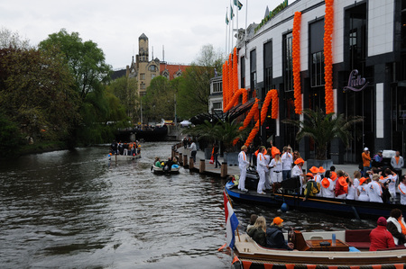 AMSTERDAM, NETHERLANDS - APRIL 30. Young People Celebrating Queensday in Amsterdam. Queensday is a popular annual festival celebrating the Queens Birthday.のeditorial素材